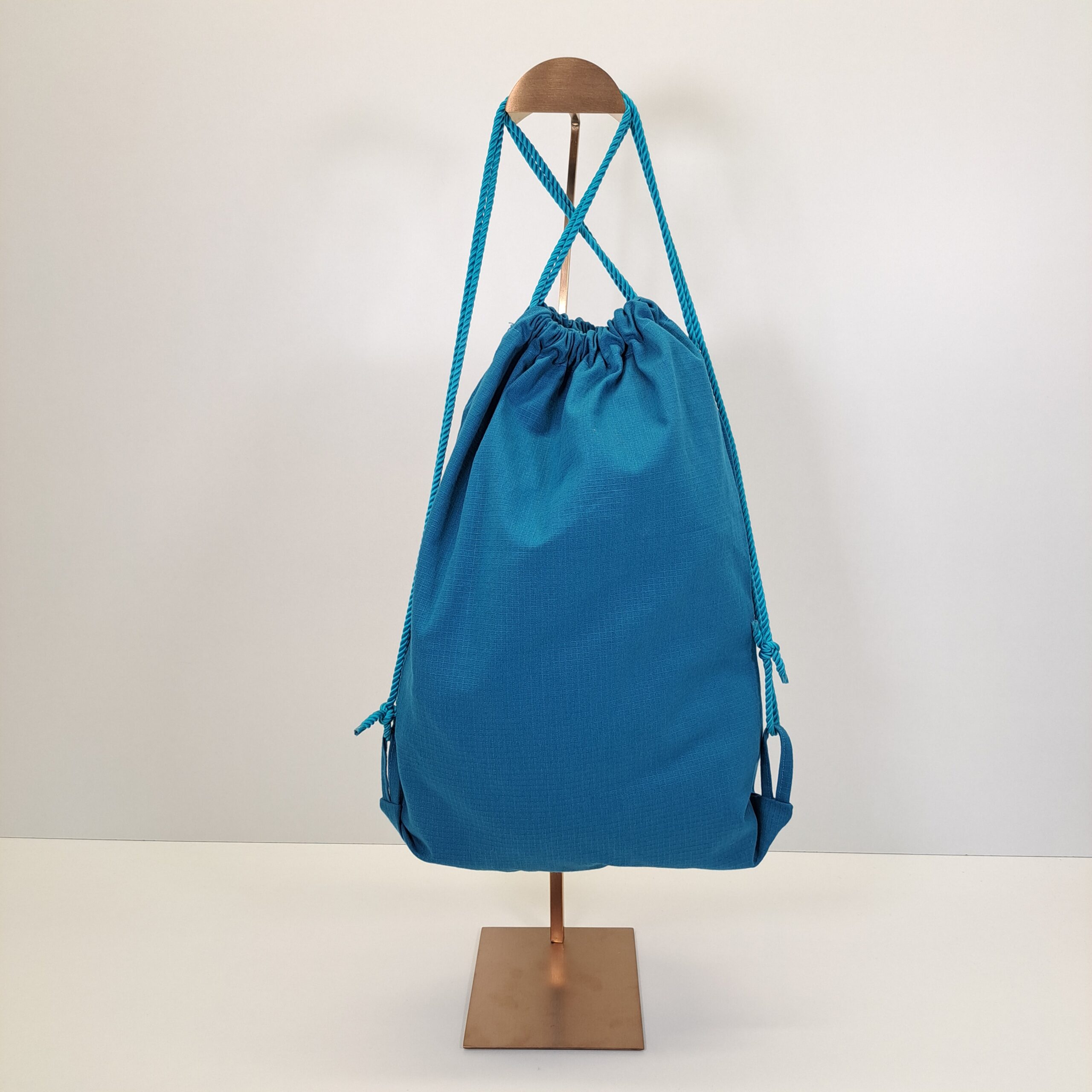 Mochila de Cordones "Teranga" – El Arte de la Bienvenida (Azul Turquesa) - Imagen 3